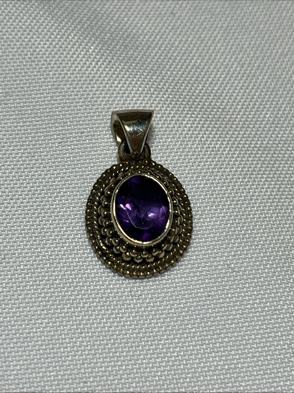 Sterling Silver Pendant with Purple Gemstone
New
925